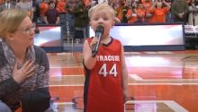 Toddler bravely grabs the mic and performs national anthem in front of 6K sports fans